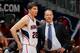 ATLANTA, GA - DECEMBER 06: Kyle Korver #26 and Mike Budenholzer of the Atlanta Hawks converse during the game against the Cleveland Cavaliers at Philips Arena on December 6, 2013 in Atlanta, Georgia. NOTE TO USER: User expressly acknowledges and agrees that, by downloading and or using this photograph, User is consenting to the terms and conditions of the Getty Images License Agreement. (Photo by Kevin C. Cox/Getty Images)