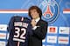 Brazil's David Luiz holds his soccer shirt, as he poses for photographers following a press conference, in Paris, Thursday, Aug. 7, 2014. Defender Luiz believes the only way to get over his World Cup disappointment is to be back on the pitch as quickly as possible. French champion Paris Saint-Germain signed Luiz on a five-year deal that was announced before his lackluster performances in Brazil's last two games at the World Cup last month. (AP Photo/Jacques Brinon)