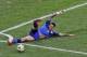 Argentina's Marcos Rojo tries to prevent the ball from going out of the pitch during the World Cup final soccer match between Germany and Argentina at the Maracana Stadium in Rio de Janeiro, Brazil, Sunday, July 13, 2014. (AP Photo/Hassan Ammar)