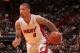 MIAMI, FL - April 2: Michael Beasley #8 of the Miami Heat handles the ball against the Milwaukee Bucks at the American Airlines Arena in Miami, Florida on April, 2 2014. NOTE TO USER: User expressly acknowledges and agrees that, by downloading and/or using this photograph, user is consenting to the terms and conditions of the Getty Images License Agreement. Mandatory copyright notice: Copyright NBAE 2014 (Photo by Issac Baldizon/NBAE via Getty Images)