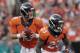 Denver Broncos quarterback Peyton Manning (18) looks to pass as teammate Ronnie Hillman looks to block during the first half of an NFL preseason football game against the Seattle Seahawks, Thursday, Aug. 7, 2014, in Denver. (AP Photo/Joe Mahoney)