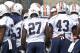 Auburn coach Gus Malzahn huddles with the team during an NCAA college football practice Friday, Aug. 1, 2014, in Auburn, Ala. (AP Photo/Brynn Anderson)