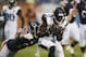 Jacksonville Jaguars wide receiver Marqise Lee (11) catches a 6-yard pass for a touchdown as Chicago Bears cornerback Kelvin Hayden (24) comes in from behind during the first half of an NFL preseason football game in Chicago, Thursday, Aug. 14, 2014. (AP Photo/Andrew Nelles)