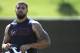 Houston Texans running back Arian Foster heads to the practice field during NFL football training Monday, June 2, 2014, in Houston. (AP Photo/Pat Sullivan)
