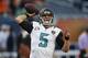 Jacksonville Jaguars quarterback Blake Bortles (5) passes during warmups before an NFL preseason football game against the against the Chicago Bears in Chicago, Thursday, Aug. 14, 2014. (AP Photo/Charles Rex Arbogast)