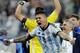Argentina's Marcos Rojo celebrates after Argentina defeated the Netherlands 4-2 in a penalty shootout after a 0-0 tie after extra time to advance to the finals during the World Cup semifinal soccer match between the Netherlands and Argentina at the Itaquerao Stadium in Sao Paulo Brazil, Wednesday, July 9, 2014. (AP Photo/Victor R. Caivano)