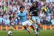 MANCHESTER, ENGLAND - MAY 11: Sergio Aguero of Manchester City competes with Matt Taylor of West Ham during the Barclays Premier League match between Manchester City and West Ham United at the Etihad Stadium on May 11, 2014 in Manchester, England. (Photo by Alex Livesey/Getty Images)
