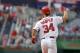 Washington Nationals’ Bryce Harper celebrates his two-run home run as he approaches second base during the 13th inning of a baseball game against the New York Mets, Thursday, Aug. 7, 2014, in Washington. The Nationals won 5-3 in 13 innings. (AP Photo/Luis M. Alvarez)