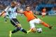 SAO PAULO, BRAZIL - JULY 09: Pablo Zabaleta of Argentina is challenged by Daley Blind of the Netherlands during the 2014 FIFA World Cup Brazil Semi Final match between the Netherlands and Argentina at Arena de Sao Paulo on July 9, 2014 in Sao Paulo, Brazil. (Photo by Jamie Squire/Getty Images)
