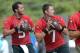 Jacksonville Jaguars quarterbacks Chad Henne (7) and Blake Bortles (5) drop back to pass during NFL football training camp in Jacksonville, Fla., Friday, July 25, 2014.(AP Photo/Phelan M. Ebenhack)