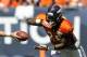 Denver Broncos running back Montee Ball takes a handoff before the start of the NFL Broncos Summer Scrimmage at Sports Authority Field at Mile High on Saturday, Aug. 2, 2014, in Denver. (AP Photo/Chris Schneider)