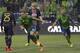 Seattle Sounders' Chad Marshall (14) and Clint Dempsey, right, celebrate after Marshall scored a goal against the Philadelphia Union in the second half of an MLS soccer match, Saturday, May 3, 2014, in Seattle. (AP Photo/Ted S. Warren)
