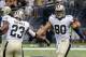 New Orleans Saints tight end Jimmy Graham (80) celebrate his touchdown reception with running back Pierre Thomas (23) in the first half of a NFL football game in New Orleans, Friday, Aug. 15, 2014. (AP Photo/Bill Haber)