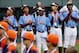 Philadelphia pitcher Mo'ne Davis, second from left, stands with her teammates before they played Nashville during a baseball game in U.S. pool play at the Little League World Series tournament in South Williamsport, Pa., Friday, Aug. 15, 2014. Philadelphia won 4-0. (AP Photo/Gene J. Puskar)