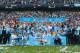 MANCHESTER, ENGLAND - MAY 11: The Manchester City players celebrate with the Premier League trophy at the end of the Barclays Premier League match between Manchester City and West Ham United at the Etihad Stadium on May 11, 2014 in Manchester, England. (Photo by Alex Livesey/Getty Images)
