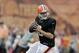 Cleveland Browns quarterback Johnny Manziel drops to pass during practice at NFL football training camp in Berea, Ohio Monday, Aug. 11, 2014. (AP Photo/Mark Duncan)