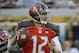 Tampa Bay Buccaneers quarterback Josh McCown looks for a receiver during the first half of an NFL preseason football game against the Jacksonville Jaguars in Jacksonville, Fla., Friday, Aug. 8, 2014. (AP Photo/John Raoux)