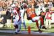 CINCINNATI, OH - DECEMBER 24: Jerome Simpson #89 of the Cincinnati Bengals jumps over Daryl Washington #58 of the Arizona Cardinals for a 19-yard touchdown during first half action at Paul Brown Stadium on December 24, 2011 in Cincinnati, Ohio. (Photo by Joe Robbins/Getty Images)