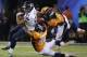 Seattle Seahawks' Golden Tate (81) is tackled by Denver Broncos' Brandon Marshall (54) and Nate Irving (56), during the first half of the NFL Super Bowl XLVIII football game Sunday, Feb. 2, 2014, in East Rutherford, N.J. (AP Photo/Matt Slocum)