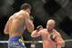 Aug 16, 2014; Bangor, ME, USA; Tim Boetsch (red gloves) fights Brad Tavares (blue gloves) during a middleweight bout in UFC Fight Night 47 at Cross Insurance Center. Mandatory Credit: Gregory J. Fisher-USA TODAY Sports