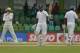 Sri Lankan batsman Mahela Jayawardene, center, celebrates scoring a fifty in his final test innings during the fourth day of the second test cricket match against Pakistan in Colombo, Sri Lanka, Sunday, Aug.17, 2014. (AP Photo/Eranga Jayawardena)