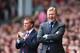 LIVERPOOL, ENGLAND - AUGUST 17: Ronald Koeman, manager of Southampton gives instructions with Brendan Rodgers, manager of Liverpool during the Barclays Premier League match between Liverpool and Southampton at Anfield on August 17, 2014 in Liverpool, England. (Photo by Alex Livesey/Getty Images)
