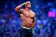 John Cena celebrates his win during Wrestlemania XXX at the Mercedes-Benz Super Dome in New Orleans on Sunday, April 6, 2014. (Jonathan Bachman/AP Images for WWE)