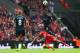 LIVERPOOL, ENGLAND - AUGUST 17: Victor Wanyama of Southampton wins a header with Philippe Coutinho of Liverpool during the Barclays Premier League match between Liverpool and Southampton at Anfield on August 17, 2014 in Liverpool, England. (Photo by Alex Livesey/Getty Images)