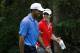 Sep 6, 2012; Carmel, IN, USA; Tiger Woods (left) and Rory McIlroy laugh as they walk together up the fairway during the first round of the BMW Championship at Crooked Stick Golf Club. Mandatory Credit: Brian Spurlock-USA TODAY Sports