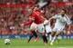 MANCHESTER, ENGLAND - AUGUST 16: Wayne Rooney of Manchester United competes with Jordi Amat of Swansea City during the Barclays Premier League match between Manchester United and Swansea City at Old Trafford on August 16, 2014 in Manchester, England. (Photo by Alex Livesey/Getty Images)