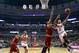 Chicago Bulls guard Derrick Rose (1) shoots over Cleveland Cavaliers center Andrew Bynum as center Joakim Noah (13) and Alonzo Gee look for a rebound during the first half of an NBA basketball game Monday, Nov. 11, 2013, in Chicago. (AP Photo/Charles Rex Arbogast)