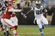 Carolina Panthers' Jonathan Stewart (28) runs past Kansas City Chiefs' Dontari Poe (92) during the first half of a preseason NFL football game in Charlotte, N.C., Sunday, Aug. 17, 2014. (AP Photo/Bob Leverone)