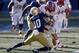 NEW YORK, NY - DECEMBER 28: Max Redfield #10 of the Notre Dame Fighting Irish tackles Tyler Kroft #86 of the Rutgers Scarlet Knights during the New Era Pinstripe Bowl at Yankee Stadium on December 28, 2013 in the Bronx borough of New York City. (Photo by Jeff Zelevansky/Getty Images)