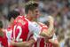 Arsenal's Olivier Giroud celebrates after his team scored scoring against Crystal Palace, during their English Premier League soccer match, at Emirates Stadium, in London, Saturday, Aug. 16, 2014. (AP Photo/Bogdan Maran)