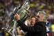 Real's coach Carlo Ancelotti lifts the Champion League trophy after his team won, at the end of the Champions League final soccer match between Atletico Madrid and Real Madrid in Lisbon, Portugal, Saturday, May 24, 2014. (AP Photo/Manu Fernandez)