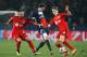PARIS, FRANCE - MARCH 12: Adrien Rabiot of Paris Saint-Germain (C) battles with Omer Toprak (L) and Philipp Wollscheid of Bayer Leverkusen (R) during the UEFA Champions League Round of 16 second leg match between Paris Saint-Germain FC and Bayer Leverkusen at Parc des Princes on March 12, 2014 in Paris, France. (Photo by Dean Mouhtaropoulos/Getty Images)