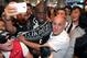 Soccer fans of Besiktas greet Demba Ba, a former Chelsea player from Senegal, at Ataturk Airport in Istanbul, Turkey, Wednesday, July 16, 2014. Ba will sign a three-year contract with Besiktas soccer club.(AP Photo/Emrah Gurel)