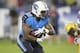 Tennessee Titans running back Bishop Sankey (20) runs the ball in the third quarter of a preseason NFL football game against the Green Bay Packers Saturday, Aug. 9, 2014, in Nashville, Tenn. (AP Photo/Wade Payne)