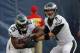 Philadelphia Eagles quarterback Nick Foles (9) hands off to running back LeSean McCoy as Eagles warm up for an NFL preseason football game against the Chicago Bears on Friday, Aug. 8, 2014, in Chicago. (AP Photo/Charles Rex Arbogast)