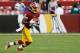 Aug 7, 2014; Landover, MD, USA; Washington Redskins wide receiver Andre Roberts (12) runs with the ball against the New England Patriots at FedEx Field. Mandatory Credit: Geoff Burke-USA TODAY Sports