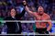 Paul Heyman, left, celebrates with Brock Lesnar after his win over the Undertaker during Wrestlemania XXX at the Mercedes-Benz Super Dome in New Orleans on Sunday, April 6, 2014. (Jonathan Bachman/AP Images for WWE)