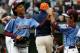Pennsylvania pitcher Mo'ne Davis, left, celebrates with teammate Jack Rice (2) after getting the final out of a 4-0 shutout against Tennessee during a baseball game in United States pool play at the Little League World Series tournament in South Williamsport, Pa., Friday, Aug. 15, 2014. (AP Photo/Gene J. Puskar)
