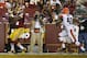 Washington Redskins wide receiver Ryan Grant (14) catches a touchdown pass in front of Cleveland Browns defensive back Royce Adams (40) during the second half of an NFL preseason football game Monday, Aug. 18, 2014, in Landover, Md. (AP Photo/Evan Vucci)