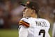 Cleveland Browns quarterback Johnny Manziel (2) watches from the sidelines during the first half of an NFL preseason football game against the Washington Redskins Monday, Aug. 18, 2014, in Landover, Md. (AP Photo/Evan Vucci)