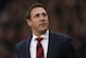 Cardiff City's manager Malky Mackay arrives at the dugout before the start of their English Premier League soccer match against Crystal Palace at Selhurst Park, London, Saturday, Dec. 7, 2013. (AP Photo/Sang Tan)