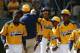 Chicago's Pierce Jones, center, celebrates with teammates after hitting a two-run home run off Lynnwood, Washington pitcher Logan Kruse during the third inning of a Little League baseball game in United States pool play at the Little League World Series tournament in South Williamsport, Pa., Thursday, Aug. 14, 2014. Pierce hit three home runs and a triple to lead Chicago to a 12-2 win. (AP Photo/Gene J. Puskar)