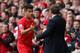 LIVERPOOL, ENGLAND - APRIL 13: Liverpool Manager Brendan Rodgers congratulates Philippe Coutinho as he is substituted during the Barclays Premier League match between Liverpool and Manchester City at Anfield on April 13, 2014 in Liverpool, England. (Photo by Alex Livesey/Getty Images)