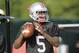 Ohio State quarterback Braxton Miller warms up during an NCAA college football practice Saturday, Aug. 9, 2014, in Columbus, Ohio. (AP Photo/Jay LaPrete)