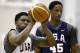 USA Basketball center Rudy Gay of the Sacramento Kings (26) shoots with USA Basketball guard DeMar DeRozan of the Toronto Raptors looking on during a team practice at the Brooklyn Nets training facility in East Rutherford, N.J., Tuesday, Aug. 19, 2014. Team USA is gearing up for the FIBA World Cup basketball tournament Aug. 30-Sept. 14 in Spain. They face the Dominican Republic Wednesday in an exhibition game at Madison Square Garden in New York. (AP Photo/Kathy Willens)