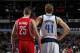 DALLAS, TX - JANUARY 29: Dirk Nowitzki #41 of the Dallas Mavericks and Chandler Parsons #25 of the Houston Rockets on January 29, 2014 at the American Airlines Center in Dallas, Texas. NOTE TO USER: User expressly acknowledges and agrees that, by downloading and or using this photograph, User is consenting to the terms and conditions of the Getty Images License Agreement. Mandatory Copyright Notice: Copyright 2014 NBAE (Photo by Glenn James/NBAE via Getty Images)